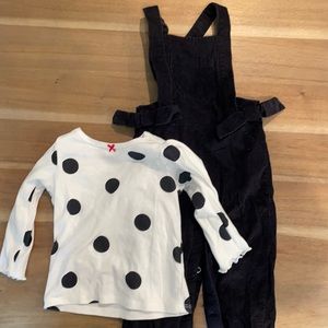 Black overalls with white polka dot shirt